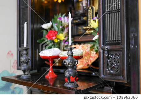 Buddhist altar with flowers and offerings Buddhist altar with flowers and offerings 108962360