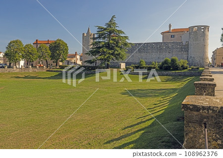 View over the tournament grounds in front of the medieval castle of the Istrian village of Svetvincenat View over the tournament grounds in front of the medieval castle of the Istrian village of Svetvincenat 108962376