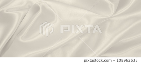 Smooth elegant golden silk or satin luxury cloth texture as wedding background. Luxurious Christmas background or New Year background design. In Sepia toned. Retro style 108962635