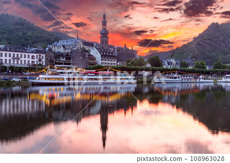 City embankment in the old medieval town of Cochem at sunset. Germany. City embankment in the old medieval town of Cochem at sunset. Germany. 108963028