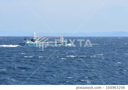 cargo ship sailing through the sea cargo ship sailing through the sea 108963206