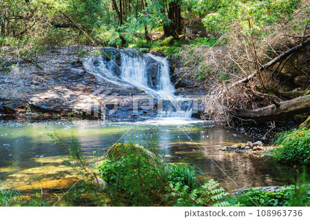 Pincho Waterfall near Viana do Castelo, Northern Portugal. View of the flowing water and beautiful lagoon, in the woods 108963736