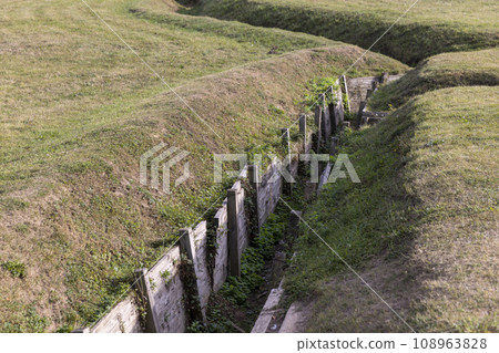 an old abandoned military trench used for defensive actions 108963828