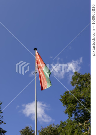 installed in slightly windy weather on the flagpole flag of the Republic of Belarus 108963836