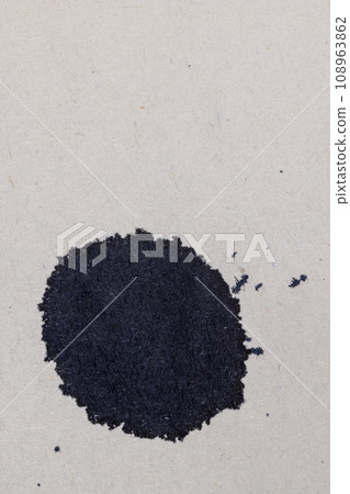 grey recycled paper with black ink drops 108963862