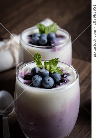 Dessert made with blueberry jam and yogurt Dessert made with blueberry jam and yogurt 108963951