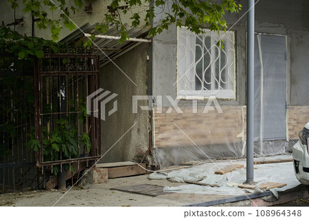 Renovation of an old residential building. The concept is aimed at giving the house a new look. With space to copy. High quality photo Renovation of an old residential building. The concept is aimed at giving the house a new look. With space to copy. High quality photo 108964348