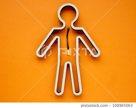 Burnout at work concept. A figurine of man with a burnt match inside. 108965063