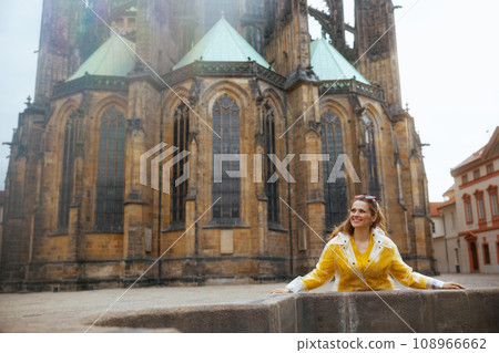 smiling trendy woman in Prague Czech Republic having excursion 108966662