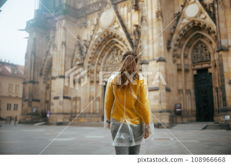 woman in blouse in Prague Czech Republic enjoying promenade woman in blouse in Prague Czech Republic enjoying promenade 108966668