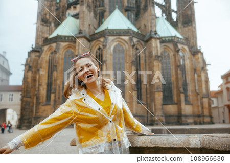 smiling modern woman in Prague Czech Republic having excursion smiling modern woman in Prague Czech Republic having excursion 108966680