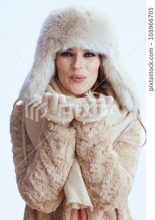 smiling stylish 40 year old woman blowing kiss on white smiling stylish 40 year old woman blowing kiss on white 108966705