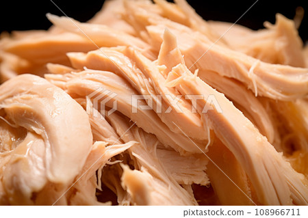 Heap of pulled chicken meat on white. A close up of shredded chicken Heap of pulled chicken meat on white. A close up of shredded chicken 108966711