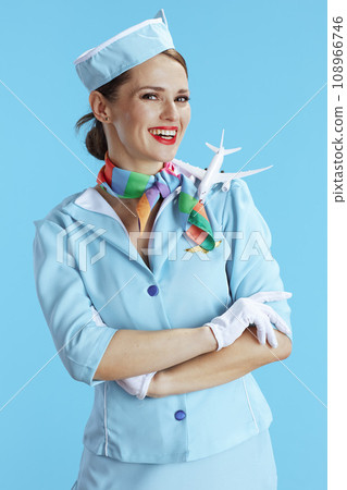happy stylish female air hostess on blue happy stylish female air hostess on blue 108966746