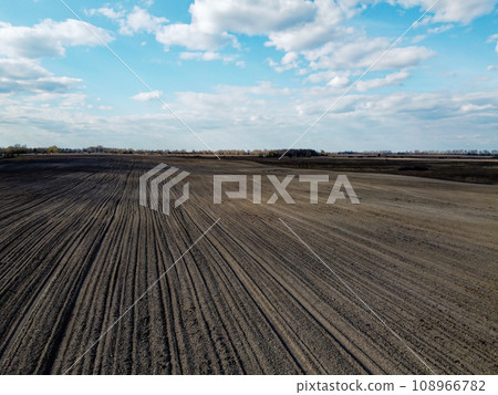 Treated farm field, aerial view. Agricultural land. 108966782