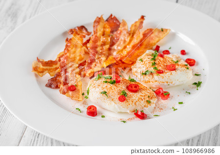 Poached eggs with bacon 108966986