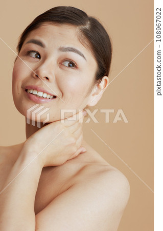 modern woman against beige background 108967022