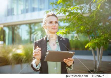 pensive modern woman employee near business center pensive modern woman employee near business center 108967490