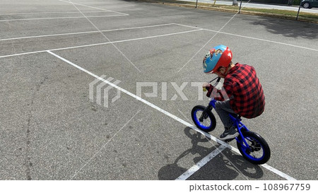 Children riding a bicycle 108967759
