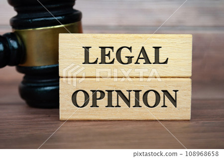 Legal Opinion text on wooden blocks with gavel background. Legal concept Legal Opinion text on wooden blocks with gavel background. Legal concept 108968658