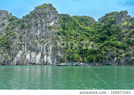 A boat for people living on the water in Ha Long Bay, Vietnam A boat for people living on the water in Ha Long Bay, Vietnam 108971091