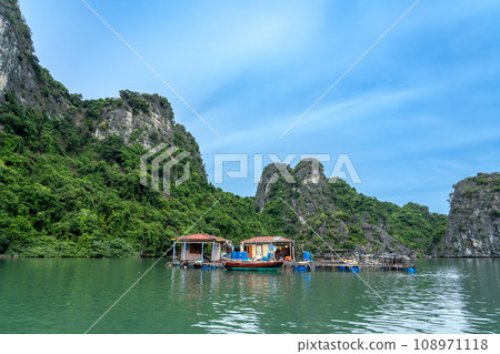 A boat for people living on the water in Ha Long Bay, Vietnam A boat for people living on the water in Ha Long Bay, Vietnam 108971118