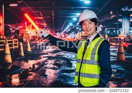 Security guard giving guidance on the road 108972182