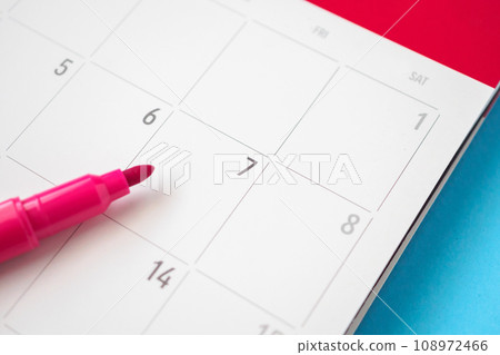 calendar page with pen close up on blue background business planning appointment meeting concept 108972466
