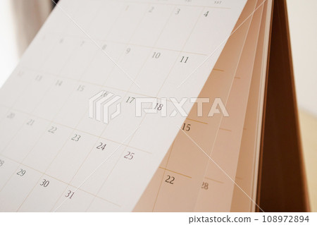 Calendar page flipping sheet close up blur background business schedule planning appointment meeting concept Calendar page flipping sheet close up blur background business schedule planning appointment meeting concept 108972894