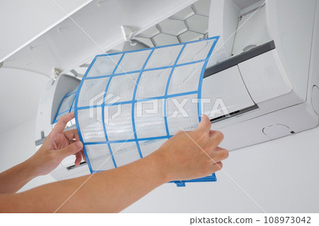 man hand hold air conditioner filter cleaning concept 108973042