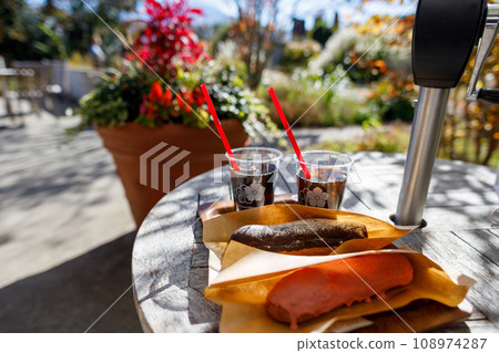 Delicious eclairs eaten outdoors on the terrace Delicious eclairs eaten outdoors on the terrace 108974287