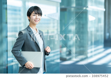 Business woman with laptop Business woman with laptop 108975452