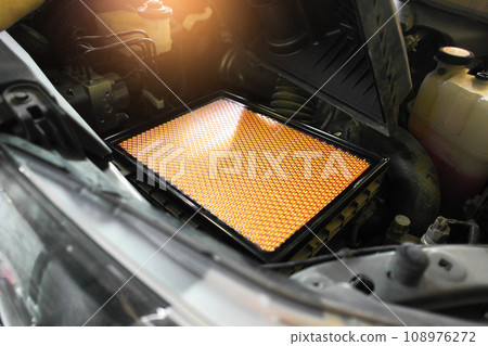 New car air filter on a filter compartment of air duct in car engine compartment New car air filter on a filter compartment of air duct in car engine compartment 108976272