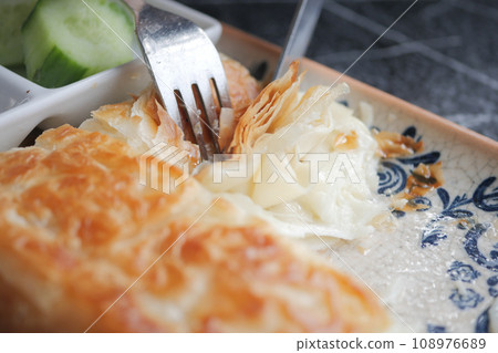 Traditional Turkish Cuisine Pastries and olive on table Traditional Turkish Cuisine Pastries and olive on table 108976689