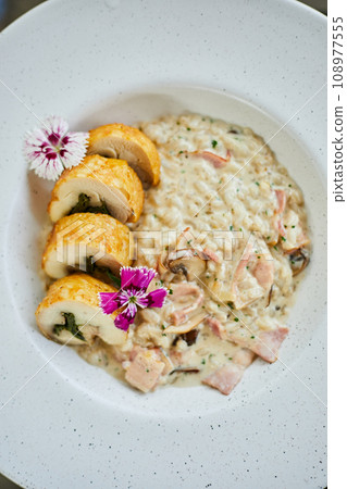 Chicken roulade with mushroom barley risotto 108977555