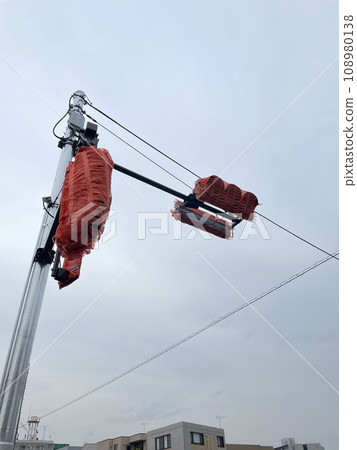 Cloudy skies and traffic lights before use 108980138