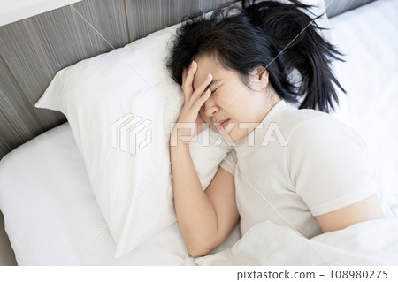 Stressed middle aged woman suffer from tension headache,migraine,tired asian female with acute stress disorder and hypertension,pain in temple and head,physical illness,stress from work,lack of sleep Stressed middle aged woman suffer from tension headache,migraine,tired asian female with acute stress disorder and hypertension,pain in temple and head,physical illness,stress from work,lack of sleep 108980275