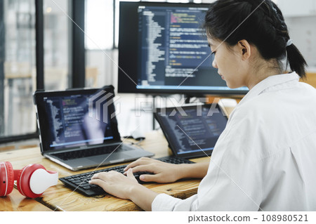 IT Programmer Starts Working on Desktop Computer. 108980521