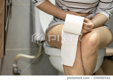 Asian woman suffering from acute cystitis,inflammation,bladder infection,urinary retention,problem of urinary stone,urinary hesitancy,frequent painful or difficult urination,presence of blood in urine Asian woman suffering from acute cystitis,inflammation,bladder infection,urinary retention,problem of urinary stone,urinary hesitancy,frequent painful or difficult urination,presence of blood in urine 108980582