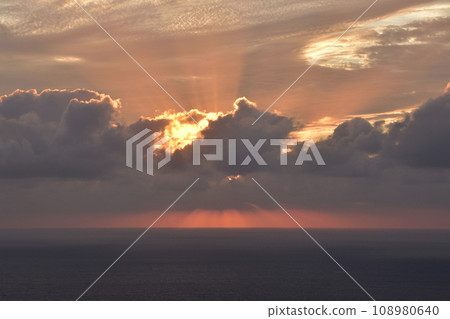 Sunset over the sea in a cloudy sky Sunset over the sea in a cloudy sky 108980640