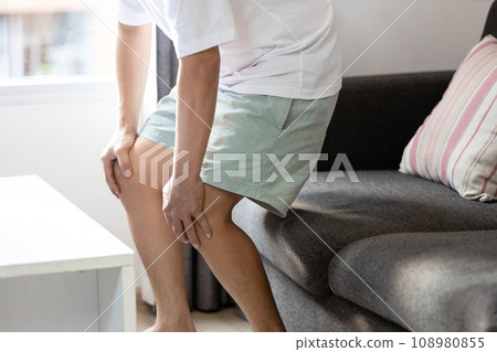 Middle aged man holding knees,pain in kneecap or muscles around knee joint,patella friction against the thigh bone,standing up with difficulty,disease of Runner's knee or Patellofemoral pain syndrome Middle aged man holding knees,pain in kneecap or muscles around knee joint,patella friction against the thigh bone,standing up with difficulty,disease of Runner's knee or Patellofemoral pain syndrome 108980855