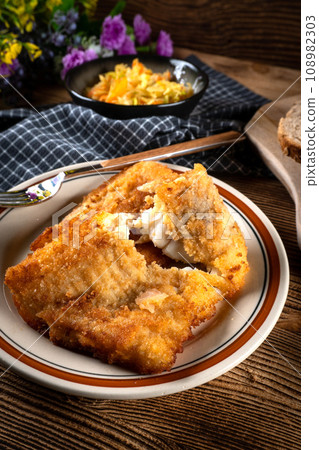 Fried cod fillet. 108982303