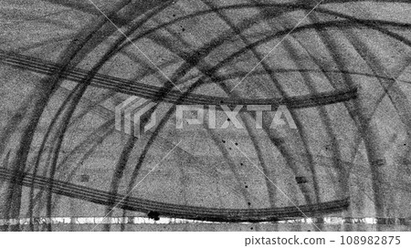 Aerial top view auto tire tread element, Car tire pattern, Wheel tyre tread track, Black tyre print on asphalt road. Aerial top view auto tire tread element, Car tire pattern, Wheel tyre tread track, Black tyre print on asphalt road. 108982875