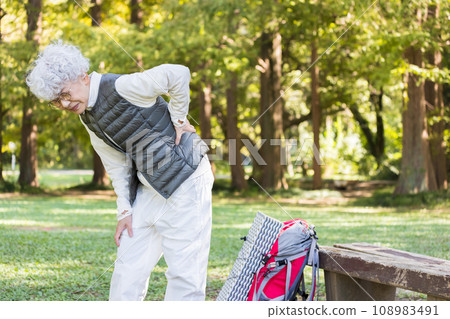 Senior woman with low back pain Senior woman with low back pain 108983491