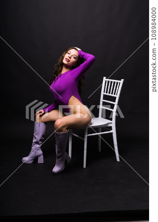 Slender and young female with beautiful and fit body. Woman in swimsuit. Sport and beauty concept. 108984000