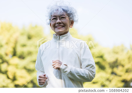 A woman in her 60s enjoying running 108984202