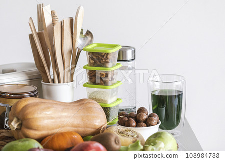 Set of healthy food and kitchen accessories, fresh smoothie on a table, close-up, copy space, selective focus. Set of healthy food and kitchen accessories, fresh smoothie on a table, close-up, copy space, selective focus. 108984788