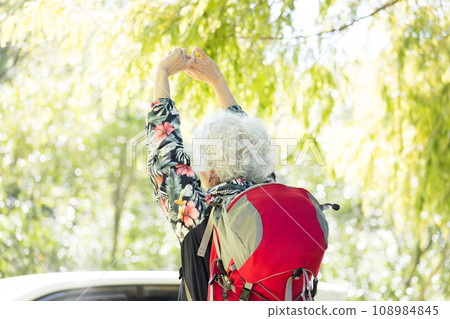 A woman in her 60s enjoying hiking 108984845