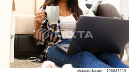 Black woman hold in hand cup of fresh aroma coffee Black woman hold in hand cup of fresh aroma coffee 108985219