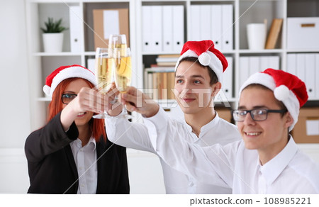 A group of businesspeople celebrating Christmas A group of businesspeople celebrating Christmas 108985221